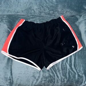 Danskin now large 12-14 black white and orange shorts stained